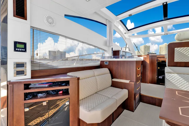 Slide: The Image of Luxurious interior of 2016 Galeon 430 HTC yacht with modern seating and panoramic windows. - 41