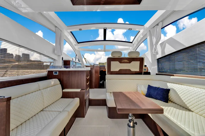 Slide: The Image of Luxurious interior of 2016 Galeon 430 HTC yacht with modern seating and panoramic windows. - 42