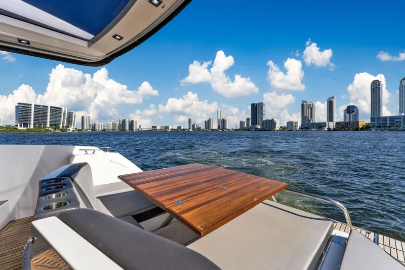 Slide: The Image of Galeon 430 HTC yacht with city skyline view, 2016 model, luxurious deck seating. - 45