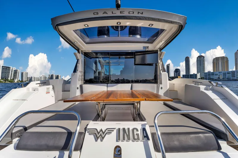 Slide: The Image of Galeon 430 HTC yacht, 2016 model, with city skyline in the background. - 48