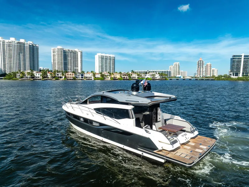 Slide: The Image of Galeon 430 HTC yacht cruising near city skyline, 2016 model. - 6