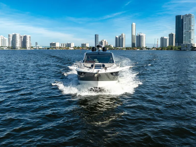 Slide: The Image of Galeon 430 HTC 2016 yacht cruising in urban waterfront setting. - 7