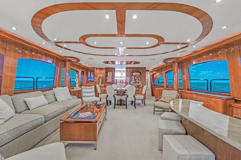 Slide: The Image of Luxurious interior of 2007 Hatteras 80 Motor Yacht with elegant wood finishes and ocean views. - 18