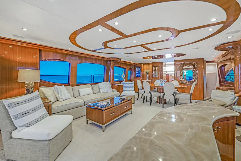 Slide: The Image of Luxurious interior of 2007 Hatteras 80 Motor Yacht with elegant wood finishes and plush seating. - 19