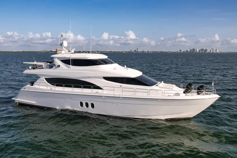 Slide: The Image of 2007 Hatteras 80 Motor Yacht cruising on open water under a clear sky. - 2