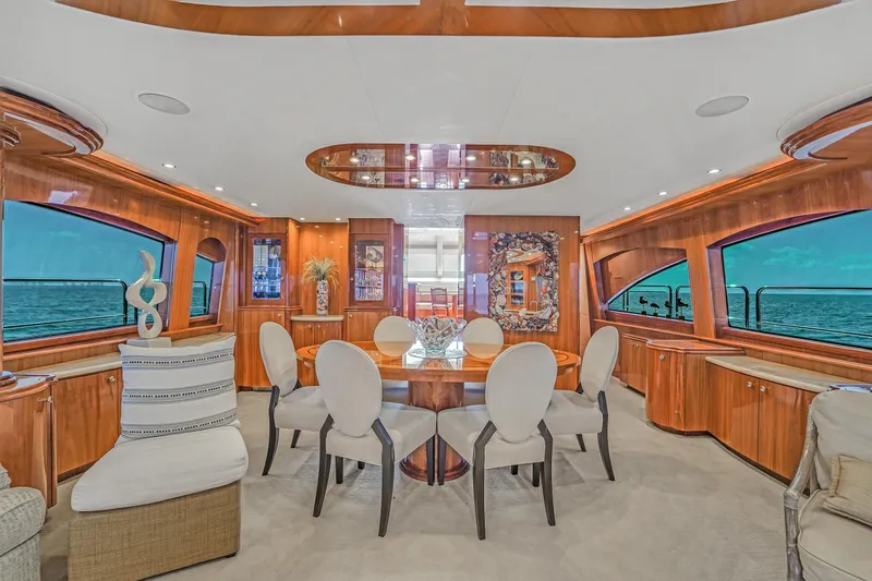 Slide: The Image of Luxurious dining area in 2007 Hatteras 80 Motor Yacht with ocean views. - 21