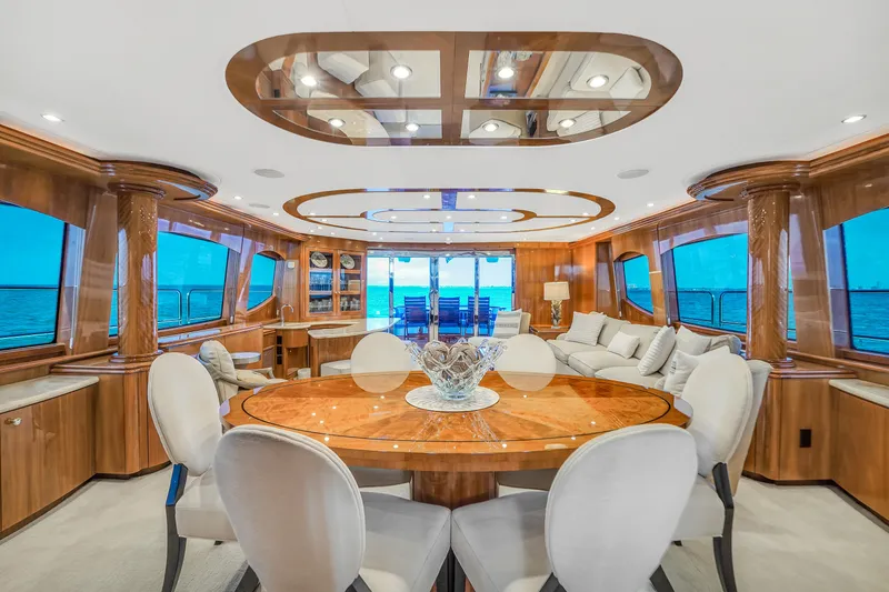 Slide: The Image of Luxurious interior of 2007 Hatteras 80 Motor Yacht with elegant dining area. - 22