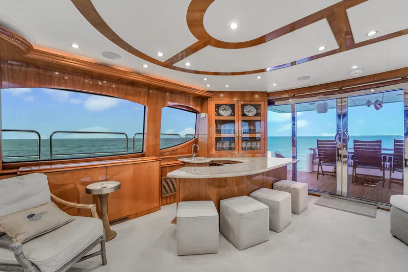 Slide: The Image of Luxurious interior of 2007 Hatteras 80 Motor Yacht with ocean view and elegant furnishings. - 25