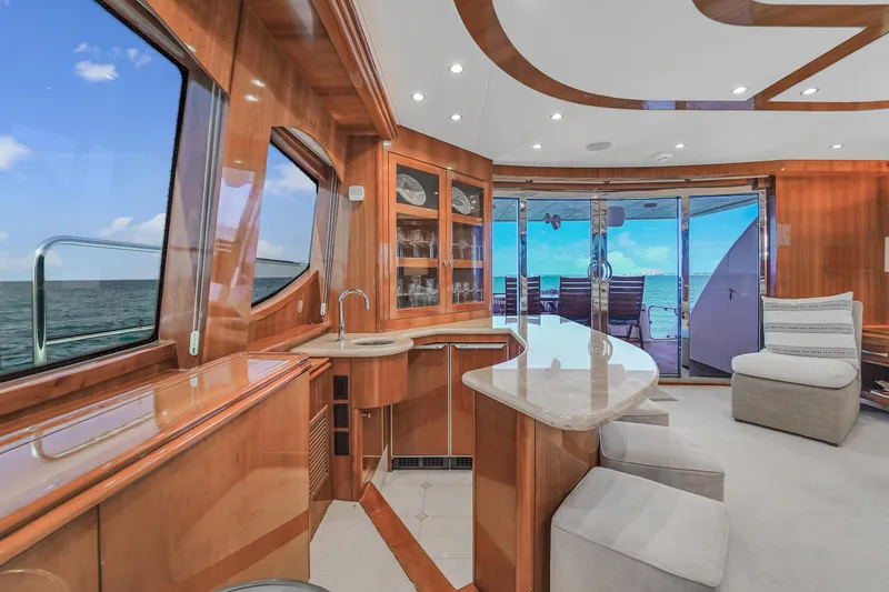 Slide: The Image of Luxurious interior of 2007 Hatteras 80 Motor Yacht with ocean view and elegant wood finishes. - 26