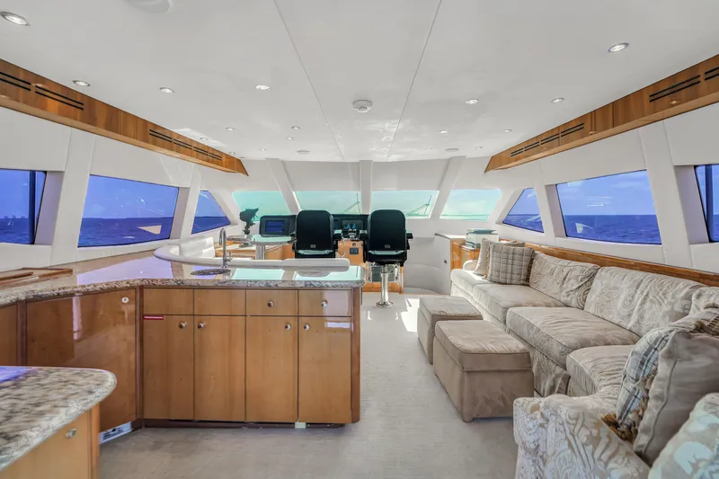 Slide: The Image of Luxurious interior of 2007 Hatteras 80 Motor Yacht with plush seating and modern helm. - 28
