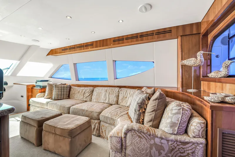 Slide: The Image of Luxurious interior of 2007 Hatteras 80 Motor Yacht with plush seating and ocean view. - 29