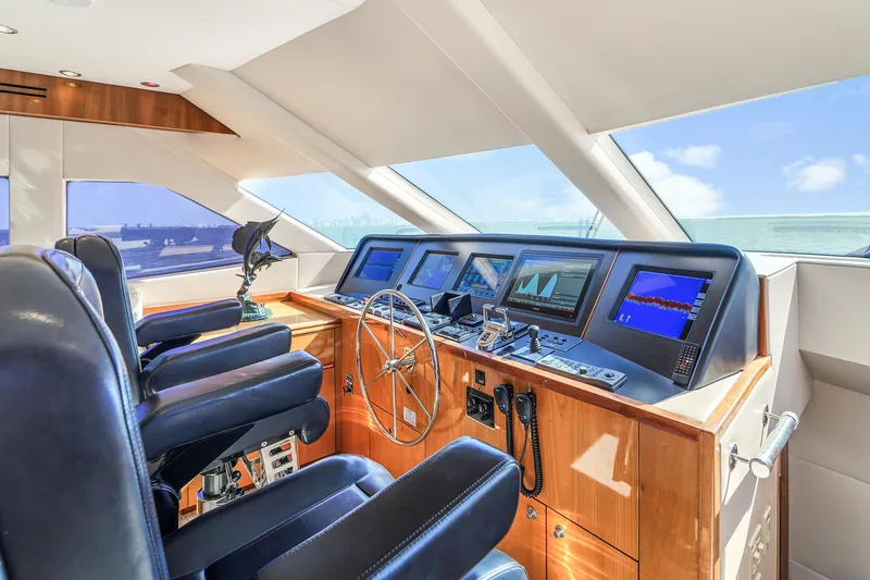 Slide: The Image of Luxurious helm of 2007 Hatteras 80 Motor Yacht with advanced navigation systems. - 34