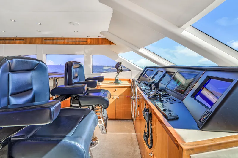 Slide: The Image of Luxurious helm of 2007 Hatteras 80 Motor Yacht with leather seats and advanced navigation systems. - 35