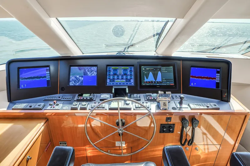 Slide: The Image of Helm of 2007 Hatteras 80 Motor Yacht with advanced navigation displays and controls. - 37