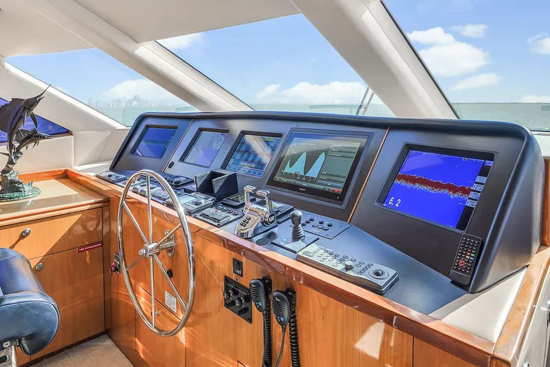 Slide: The Image of Helm of 2007 Hatteras 80 Motor Yacht with navigation screens and controls. - 38