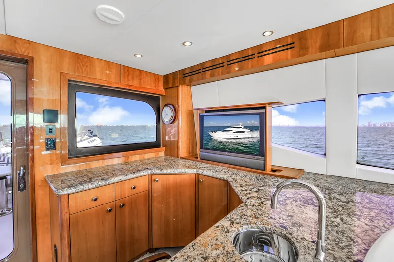 Slide: The Image of Luxurious 2007 Hatteras 80 Motor Yacht interior with granite countertops and ocean view. - 41