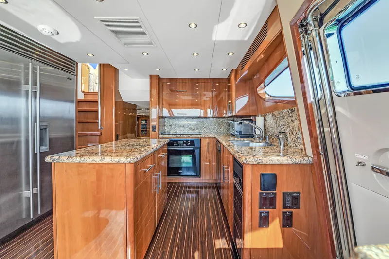 Slide: The Image of Luxurious kitchen interior of 2007 Hatteras 80 Motor Yacht with granite countertops. - 43