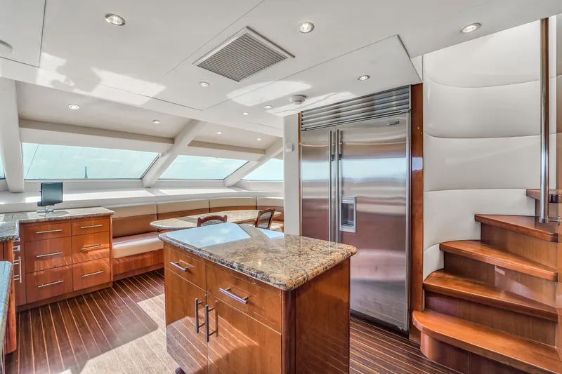 Slide: The Image of Luxurious kitchen interior of 2007 Hatteras 80 Motor Yacht with wood finishes and modern appliances. - 45