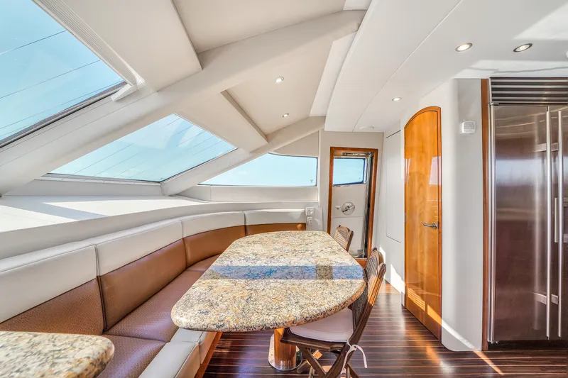 Slide: The Image of Luxurious interior of 2007 Hatteras 80 Motor Yacht with granite table and skylights. - 48