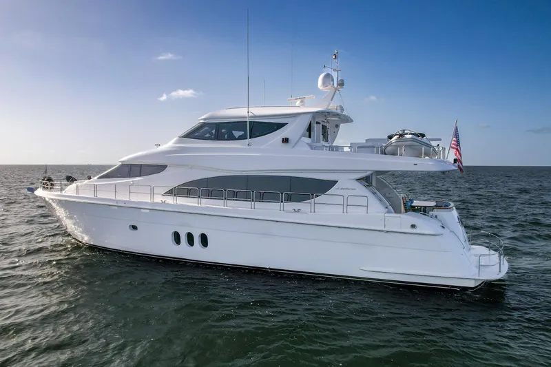 Slide: The Image of 2007 Hatteras 80 Motor Yacht cruising on open water under clear skies. - 9