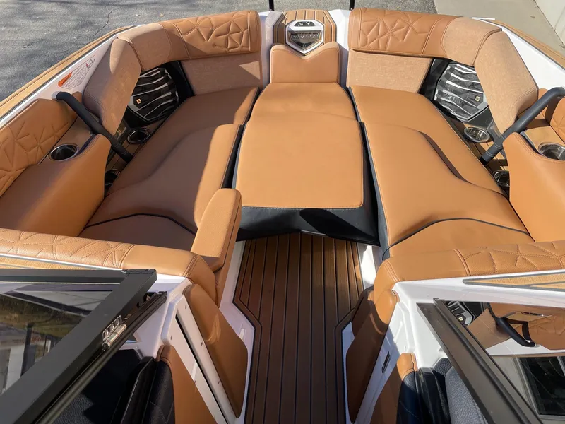 Slide: The Image of 2023 Nautique Super Air Nautique G25 Paragon interior with luxurious tan seating. - 11