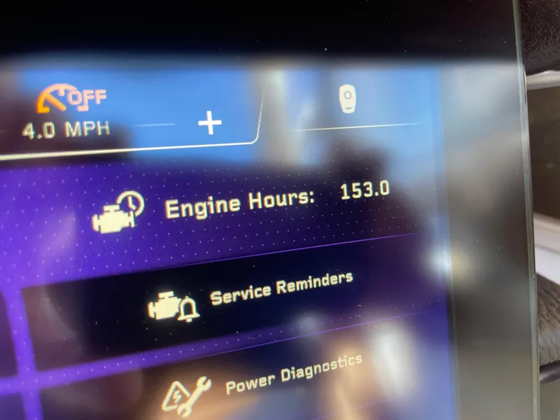 Slide: The Image of Dashboard display of 2023 Nautique Super Air Nautique G25 Paragon showing 153 engine hours. - 13