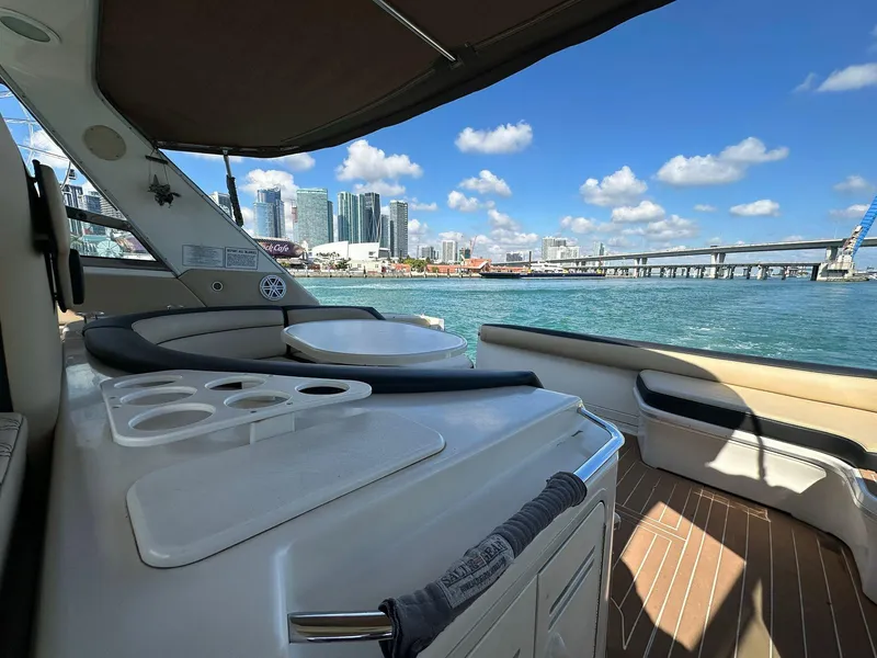 Slide: The Image of 1998 Sea Ray 500 Sundancer yacht interior with city skyline and ocean view. - 11