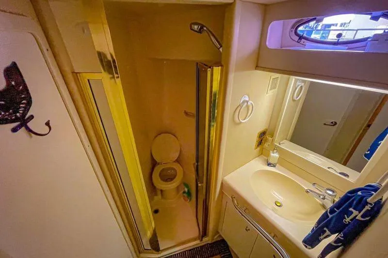 Slide: The Image of Bathroom interior of 1998 Sea Ray 500 Sundancer yacht with shower and sink. - 20