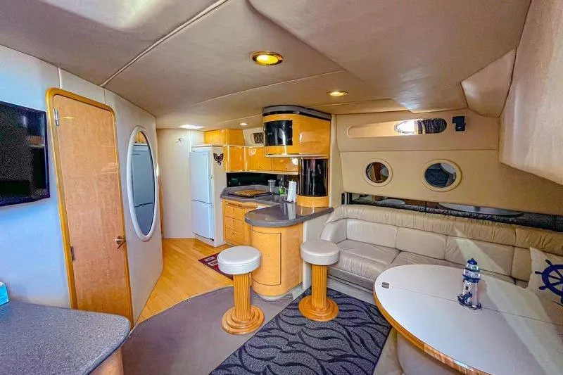 Slide: The Image of Luxurious interior of a 1998 Sea Ray 500 Sundancer yacht with modern amenities. - 21