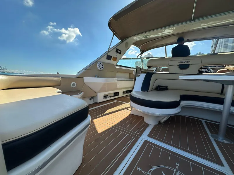 Slide: The Image of Luxurious 1998 Sea Ray 500 Sundancer interior with elegant seating and wooden flooring. - 22