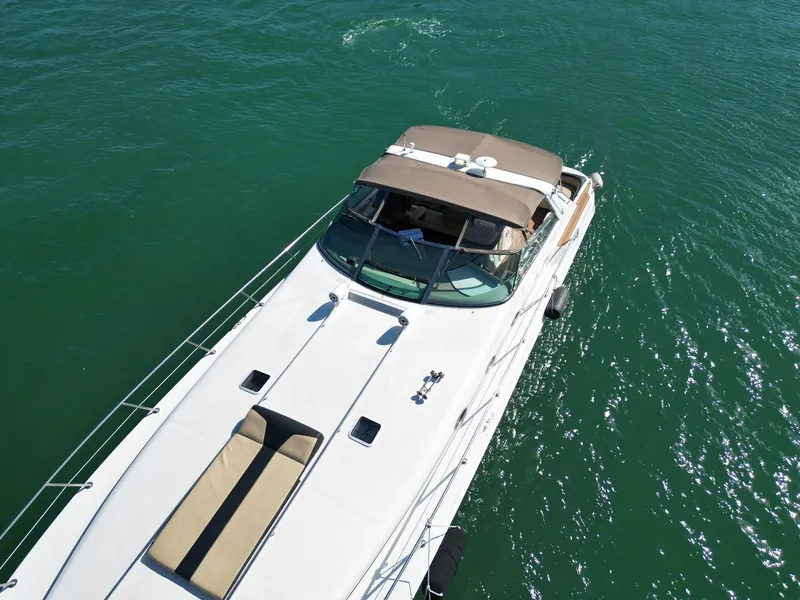 Slide: The Image of Aerial view of 1998 Sea Ray 500 Sundancer yacht on open water. - 25