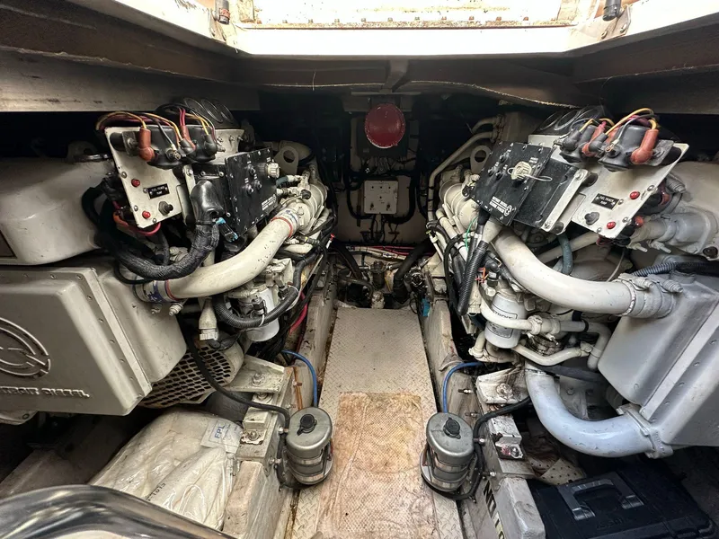 Slide: The Image of Engine room of 1998 Sea Ray 500 Sundancer with dual engines and wiring. - 28