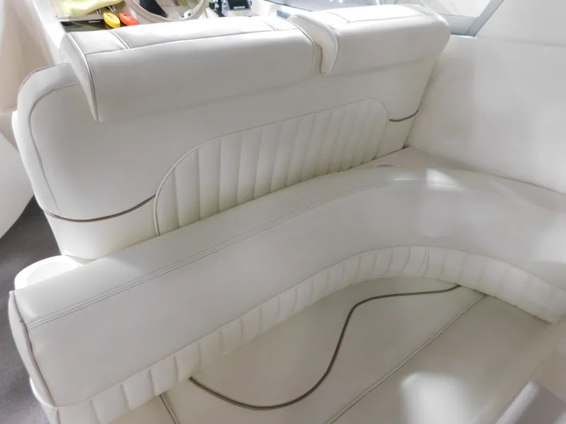 Slide: The Image of 1998 Cruisers 2870 Rogue boat interior with white leather seating. - 11