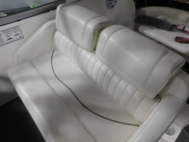 Slide: The Image of 1998 Cruisers 2870 Rogue boat interior with white leather seating. - 13