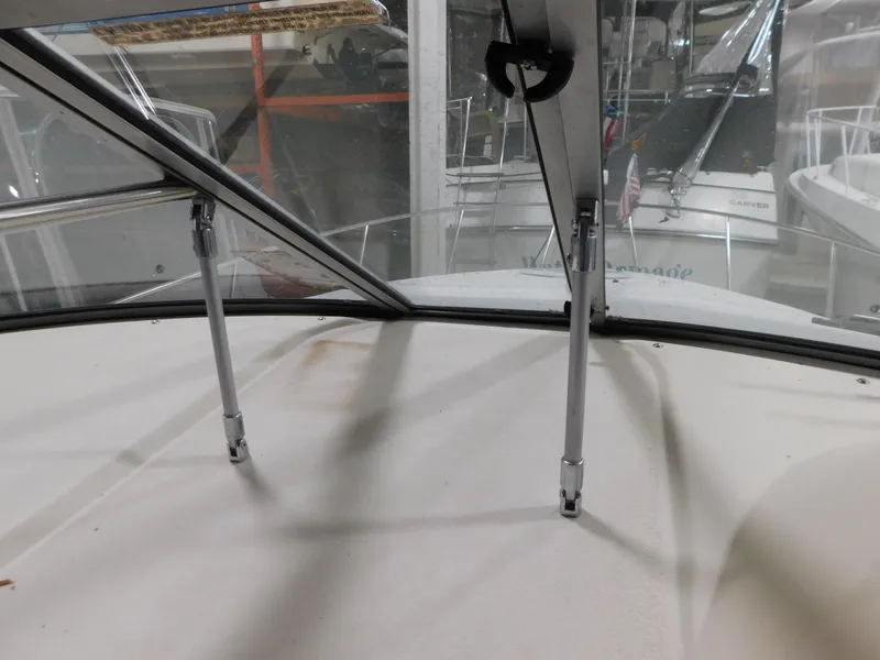 Slide: The Image of 1998 Cruisers 2870 Rogue boat windshield and deck view in storage. - 16