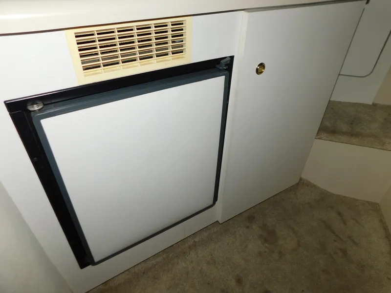 Slide: The Image of 1998 Cruisers 2870 Rogue interior with compact refrigerator and cabinetry. - 20