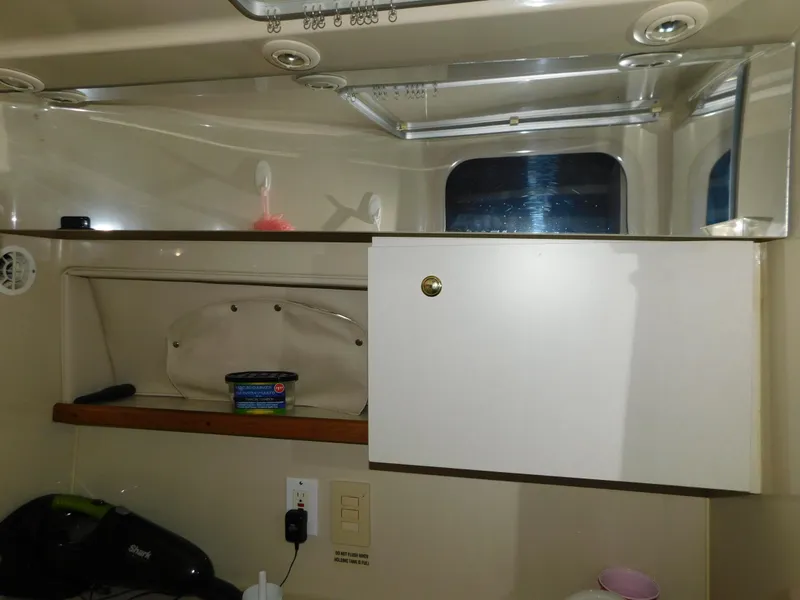 Slide: The Image of 1998 Cruisers 2870 Rogue interior with storage cabinet and shelf. - 26