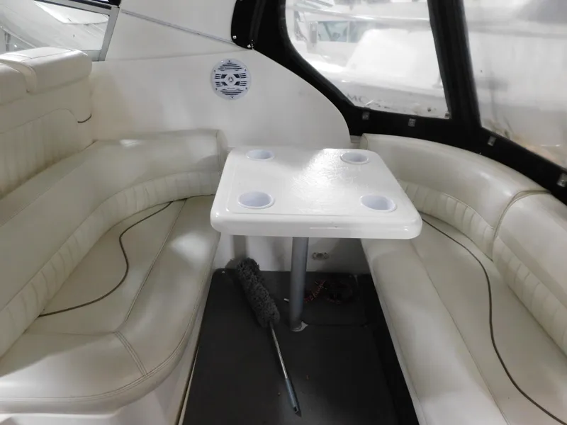 Slide: The Image of 1998 Cruisers 2870 Rogue interior with white seating and table. - 8