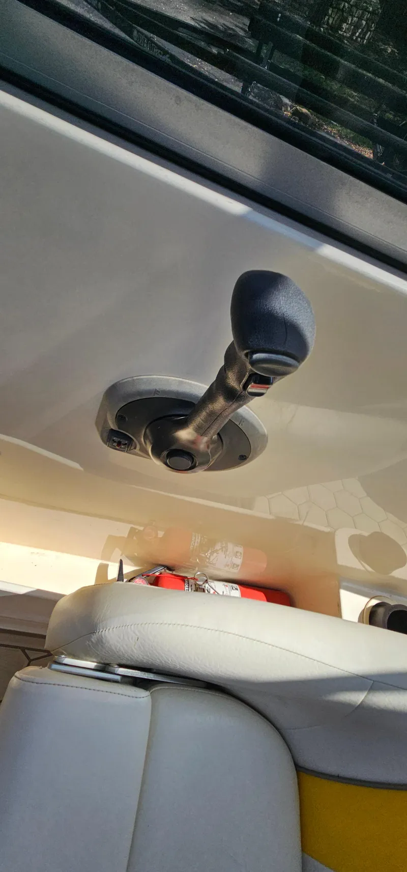 Slide: The Image of Close-up of a 2003 Rinker RX1 boat throttle lever. - 19