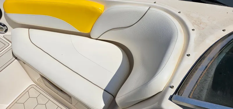 Slide: The Image of 2003 Rinker RX1 boat seat with white and yellow upholstery. - 4