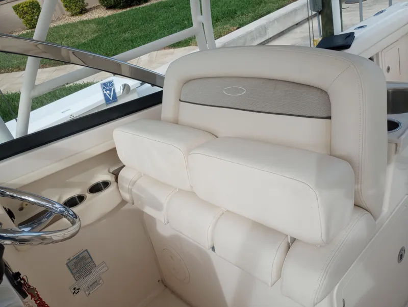 Slide: The Image of 2016 Grady-White Freedom 307 boat interior, docked in a marina. - 13
