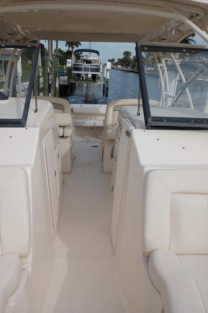 Slide: The Image of Storage compartment with rope on 2016 Grady-White Freedom 307 boat. - 22
