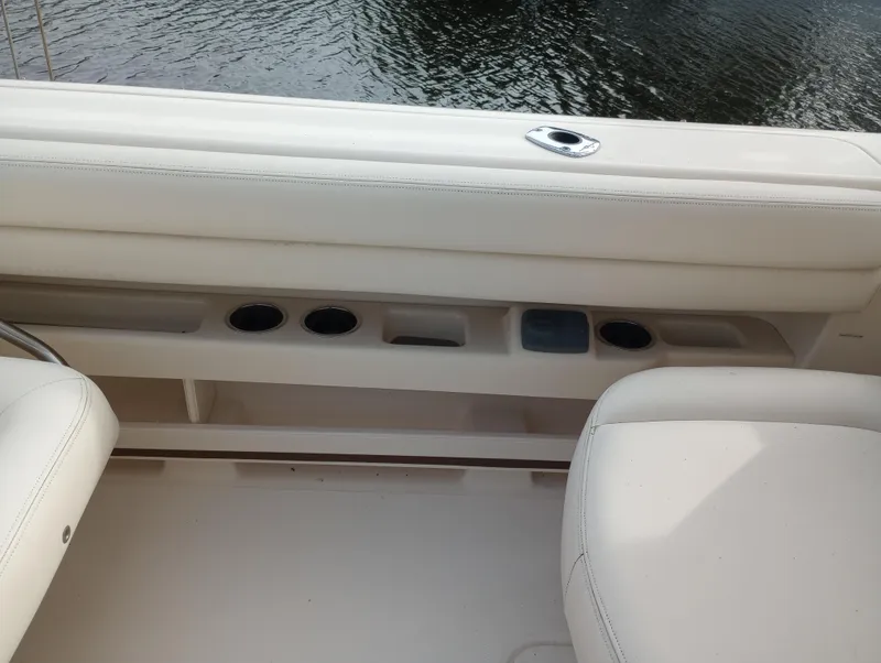 Slide: The Image of 2016 Grady-White Freedom 307 boat dashboard with navigation controls and display. - 23