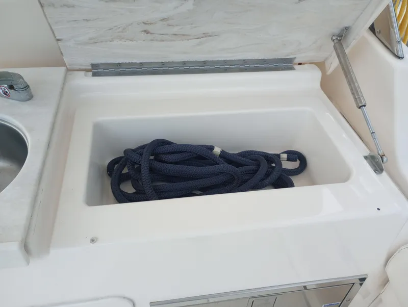 Slide: The Image of Interior cabin of 2016 Grady-White Freedom 307 boat with seating and storage. - 27