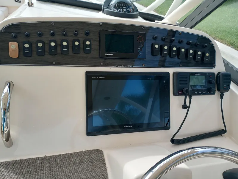 Slide: The Image of 2016 Grady-White Freedom 307 boat interior with sink and seating area. - 28