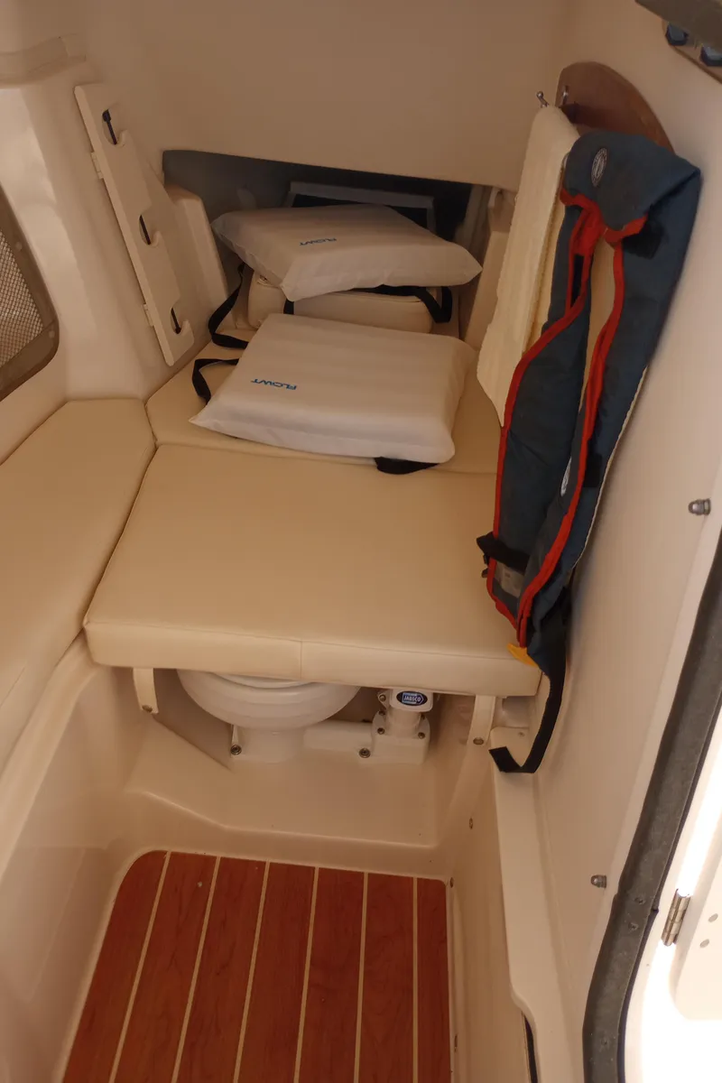 Slide: The Image of 2016 Grady-White Freedom 307 livewell with open lid, showcasing interior. - 32