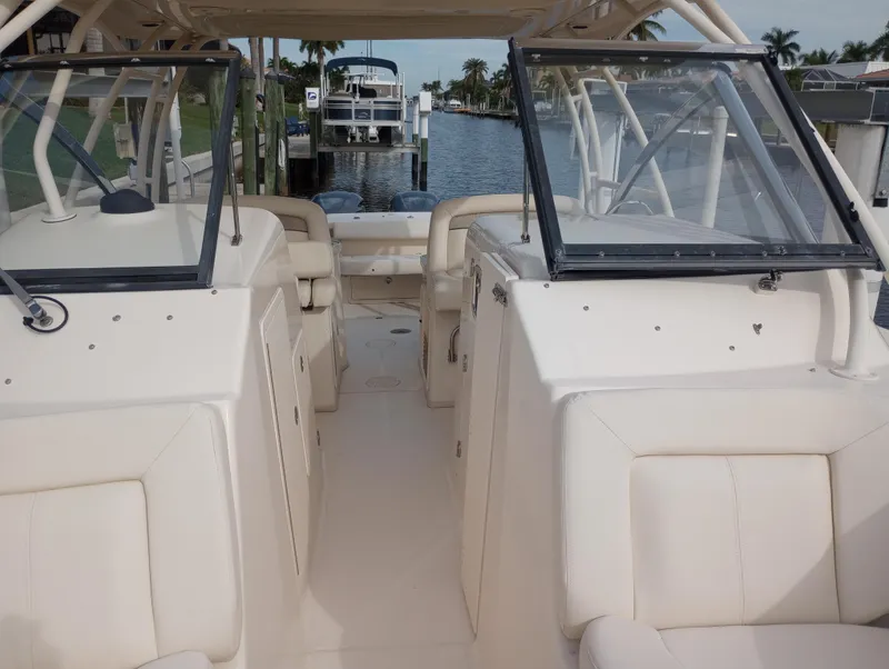 Slide: The Image of 2016 Grady-White Freedom 307 boat interior with open cockpit and seating. - 6