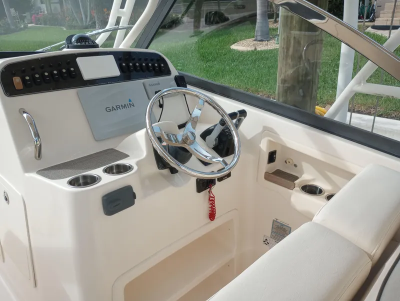 Slide: The Image of 2016 Grady-White Freedom 307 boat helm with Garmin navigation system. - 7