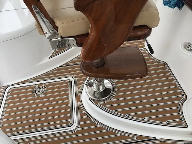 Slide: The Image of Viking 42 Open 2016 boat interior with wooden seat and deck flooring. - 12
