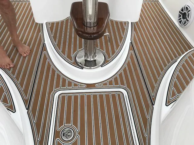 Slide: The Image of 2016 Viking 42 Open boat deck with teak flooring and chrome accents. - 14